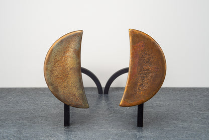 Borough Furnace Moon Andirons: sculptural crescent bronze finials on blackened steel firedog frame