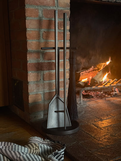 Large Seru Truex Bronze Hearth Tools in front of a fireplace
